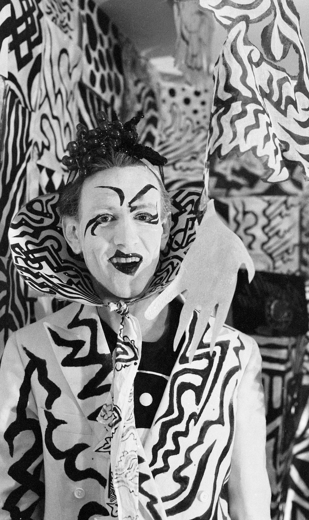 JET in costume amid painted scenery. An editorial companion to his recollection of �otherworldly panoramas� and transformed attire. Photograph by Joseph Johnston; from the memorial�s sets-and-costumes collection.